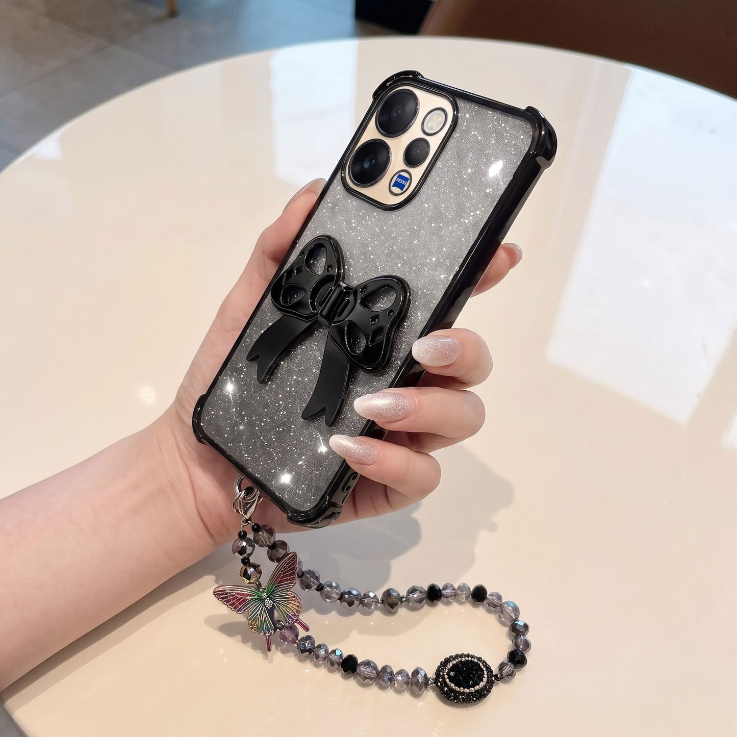 Vivo V70 5G Luxury Shimmer Airbag Bow Stand Case with Charm Strap